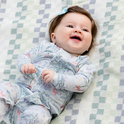 Love You Deerly Ruffle Footie from Magnetic Me. This modal Magnetic Footie with Ruffles, designed with magnetic closures, is a quick and quiet lifesaver for all-day and middle-of-the-night diaper changes—that's up to 12 times a day (!). Made from sustainable modal, it's a silky-soft and temperature-regulating sleeper to keep your little one comfy from head to toe.

TENCEL™ modal is bio-based, ethically sourced, biodegradable and more durable than bamboo.