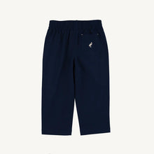 Load image into Gallery viewer, The Prepletic Sheffield Pants in Nantucket Navy by The Beaufort Bonnet Company blend timeless style with performance fabric, offering comfort and durability for your little one. The classic silhouette and signature stork detail elevate every outfit, perfect for any occasion from playtime to special moments!
