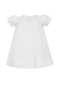Transform your little girl into an angel with our White Bishop Dress from Petit Bebe. This stunning dress features intricate embroidered gold crosses, adding a touch of elegance to any special occasion. Made for toddler girls, it's the perfect blend of style and comfort.