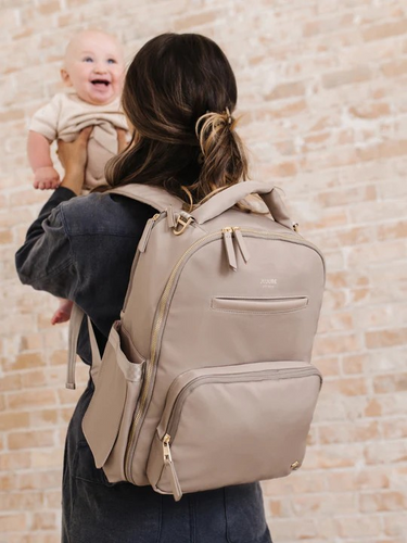 The Classic Backpack from JuJuBe has a sleek, innovative design that makes it easier than ever to stay organized on the go. This spacious, intuitively designed bag holds all your baby essentials—diapers, snacks, drinks, extra clothes, and more—plus personal items like your wallet, keys, and phone. Keep everything you need at your fingertips with an easy-access wipe pocket, insulated bottle pocket, and quick-reach cell phone pocket. The main compartment opens completely flat like a suitcase for easy packing,