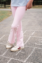 Load image into Gallery viewer, Watch her strut, stretch, and shine in the&nbsp;Girls' Athletic Flare Legging in Pink Lady —a bold twist on a classic activewear staple. With its comfy high-rise waistband and flattering flare leg, this legging blends form, function, and a whole lot of fun. Built for everything from yoga class to dance rehearsal to weekend errands with mom.
