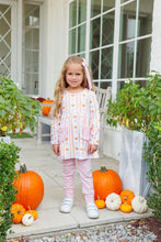 Load image into Gallery viewer, Celebrate pumpkin patch days in the Pumpkin Patch Ruffle Pant Set by Trotter Street Kids. The vibrant orange tunic, sprinkled with charming pumpkins and trimmed with pink pockets, pairs effortlessly with soft pink leggings—crafted for comfort and endless playful adventures!
