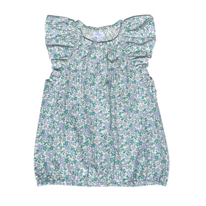 This girl's Allie Meadow Top from Pleat features a soft green and blue floral print, delicate ruffle shoulders, and cap sleeves for a charming and feminine look. The blousy feel adds comfort and ease, making it perfect for any occasion. Pair it with the coordinating tiered skirt for a complete and stylish outfit.