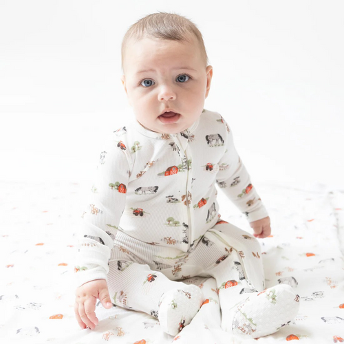 Dress your little one in cozy comfort with the Little Farm Life 2 Way Zipper Footie by Angel Dear. Crafted from soft, ribbed modal fabric, it ensures gentle warmth and breathability. The charming classic farm scene adds a delightful touch, perfect for infants exploring their farm life dreams. Convenient 2-way zipper design makes diaper changes quick and easy, helping busy parents save time. This footie blends practicality with adorable style, making it an essential addition to your baby's wardrobe.