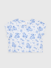 Load image into Gallery viewer, The Girls Nicole Slouch Tee from J. Marie brings effortless style to her everyday wardrobe. Featuring a charming floral print on a relaxed slouch silhouette, this tee is designed for the modern tween who loves comfort without compromising on trend. The laid-back fit pairs perfectly with the Nicole Athletic Skirt for a coordinated floral look, or works beautifully on its own with her favorite bottoms. Versatile, comfortable, and on-trend—this tee is ready for everything from school days to weekend adventures
