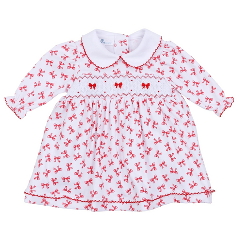 Dress your little one in timeless elegance with the Infant Girls Scarlett Bows Smocked Dress from Magnolia Baby. Crafted from 100% soft, breathable Pima cotton, this dress ensures all-day comfort for delicate skin. Its charming red bows print adds a playful yet refined touch, while the delicate smocked chest and red picot trim on the collar and cuffs offer classic handcrafted details. The ruffled skirt completes the look with sweet sophistication, and the included diaper cover makes it perfect for any speci
