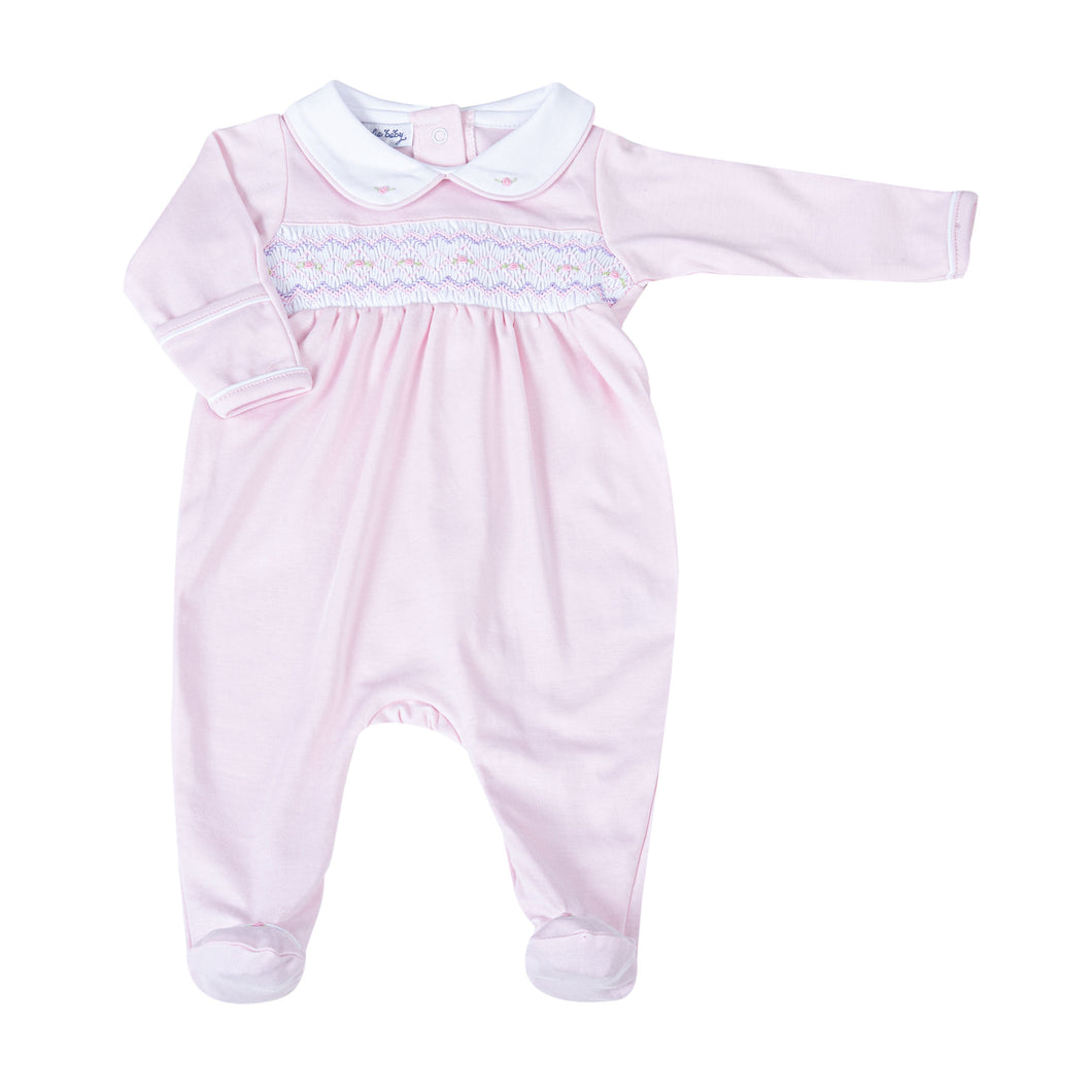 Experience unparalleled comfort for your little one with the Hazel and Hudson Smocked Collar Pink Footie from Magnolia Baby. This adorable footie features a soft pink color and a delicate white peter pan collar with lovely smocking across the chest adorned with sweet pink rosettes. Give your baby a cozy and stylish look today!