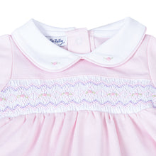 Load image into Gallery viewer, Experience unparalleled comfort for your little one with the Hazel and Hudson Smocked Collar Pink Footie from Magnolia Baby. This adorable footie features a soft pink color and a delicate white peter pan collar with lovely smocking across the chest adorned with sweet pink rosettes. Give your baby a cozy and stylish look today!
