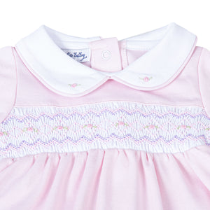 Experience unparalleled comfort for your little one with the Hazel and Hudson Smocked Collar Pink Footie from Magnolia Baby. This adorable footie features a soft pink color and a delicate white peter pan collar with lovely smocking across the chest adorned with sweet pink rosettes. Give your baby a cozy and stylish look today!