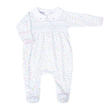 Load image into Gallery viewer, Treat your little one to ultimate comfort with Clara&#39;s Classics Smocked Collared Footie Pajamas. Made by Magnolia Baby, these adorable footie pajamas feature a delicate floral print and smocking detail, perfect for infant girls. Give her the sweetest sleep in these cozy, stylish pajamas.
