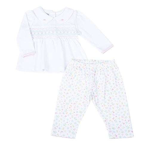 Clara's Classics Smocked Collared Tunic Set - the perfect outfit for your little one's wardrobe. This delicate white tunic features a beautiful smocked design and is paired with matching floral print leggings. From outings to special occasions, your little girl will look adorable and feel comfortable in this Magnolia Baby set.