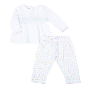 Clara's Classics Smocked Collared Tunic Set - the perfect outfit for your little one's wardrobe. This delicate white tunic features a beautiful smocked design and is paired with matching floral print leggings. From outings to special occasions, your little girl will look adorable and feel comfortable in this Magnolia Baby set.