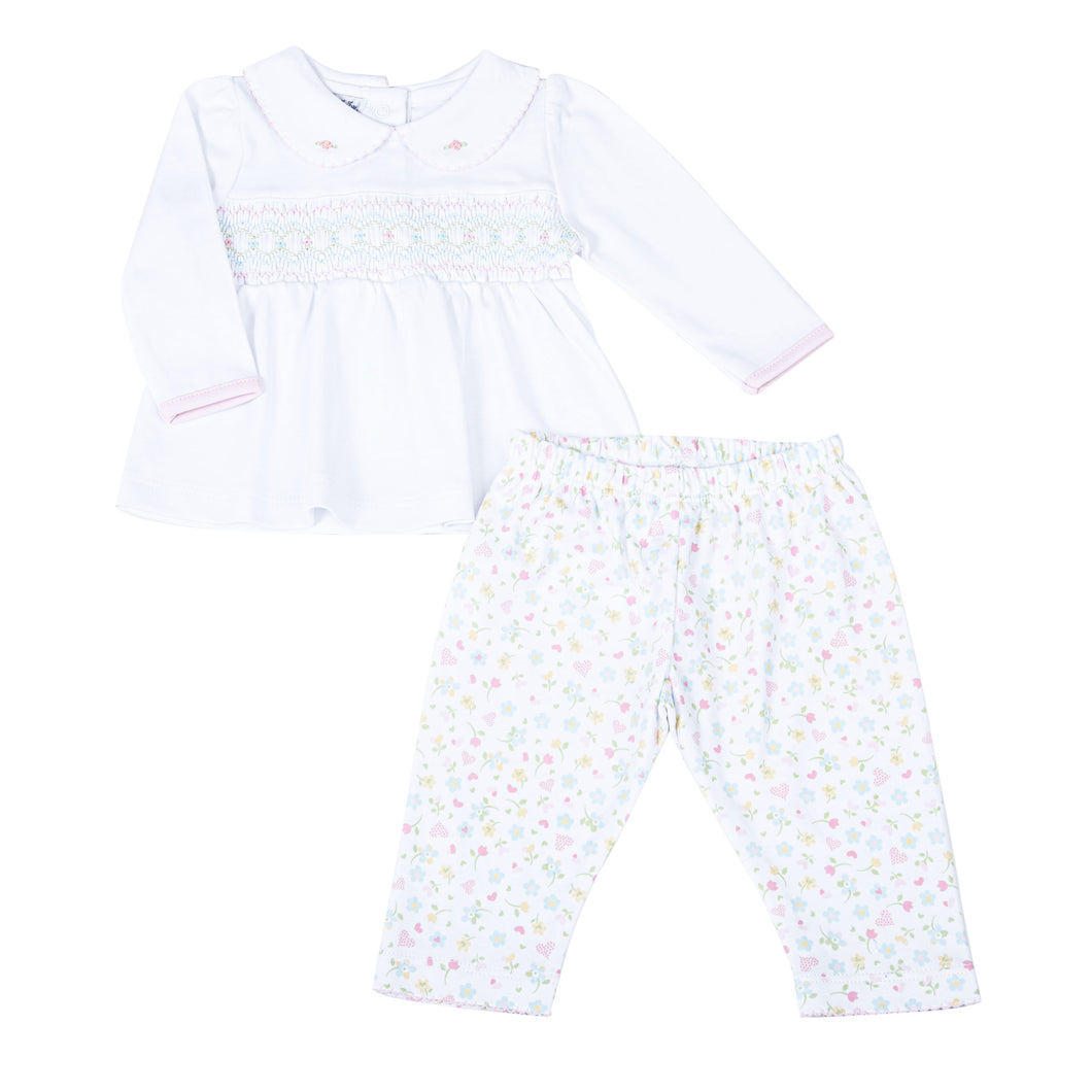 Clara's Classics Smocked Collared Tunic Set - the perfect outfit for your little one's wardrobe. This delicate white tunic features a beautiful smocked design and is paired with matching floral print leggings. From outings to special occasions, your little girl will look adorable and feel comfortable in this Magnolia Baby set.