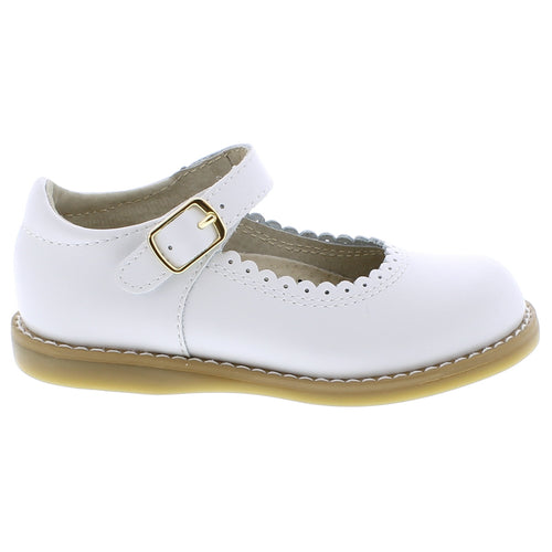 Make every step comfortable with Footmates Allie Mary Jane. Featuring an adjustable hook-and-loop strap and Custom Fit System with two interchangeable insoles for a perfect fit. The scalloped detail adds a sweet touch to this simple loafer.