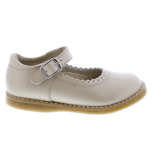 Make every step comfortable with Footmates Allie Mary Jane. Featuring an adjustable hook-and-loop strap and Custom Fit System with two interchangeable insoles for a perfect fit. The scalloped detail adds a sweet touch to this simple loafer.