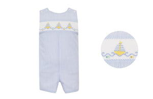 Dress your little one in timeless summer style with the Boy's Light Blue Sailboat Seersucker Jon Jon from Anavini. Crafted from light blue and white striped seersucker fabric, this outfit features delicate hand-smocked detailing and charming embroidered sailboats. Perfect for infants and toddlers, its classic nautical design ensures your child looks adorable and stays comfortable at any summer occasion.