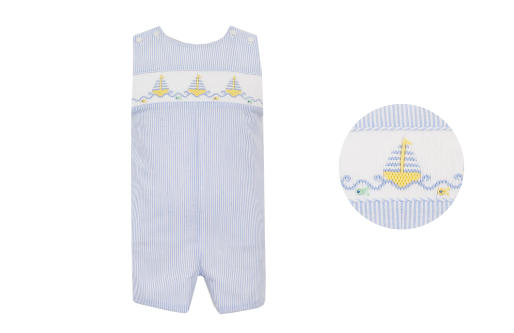Dress your little one in timeless summer style with the Boy's Light Blue Sailboat Seersucker Jon Jon from Anavini. Crafted from light blue and white striped seersucker fabric, this outfit features delicate hand-smocked detailing and charming embroidered sailboats. Perfect for infants and toddlers, its classic nautical design ensures your child looks adorable and stays comfortable at any summer occasion.
