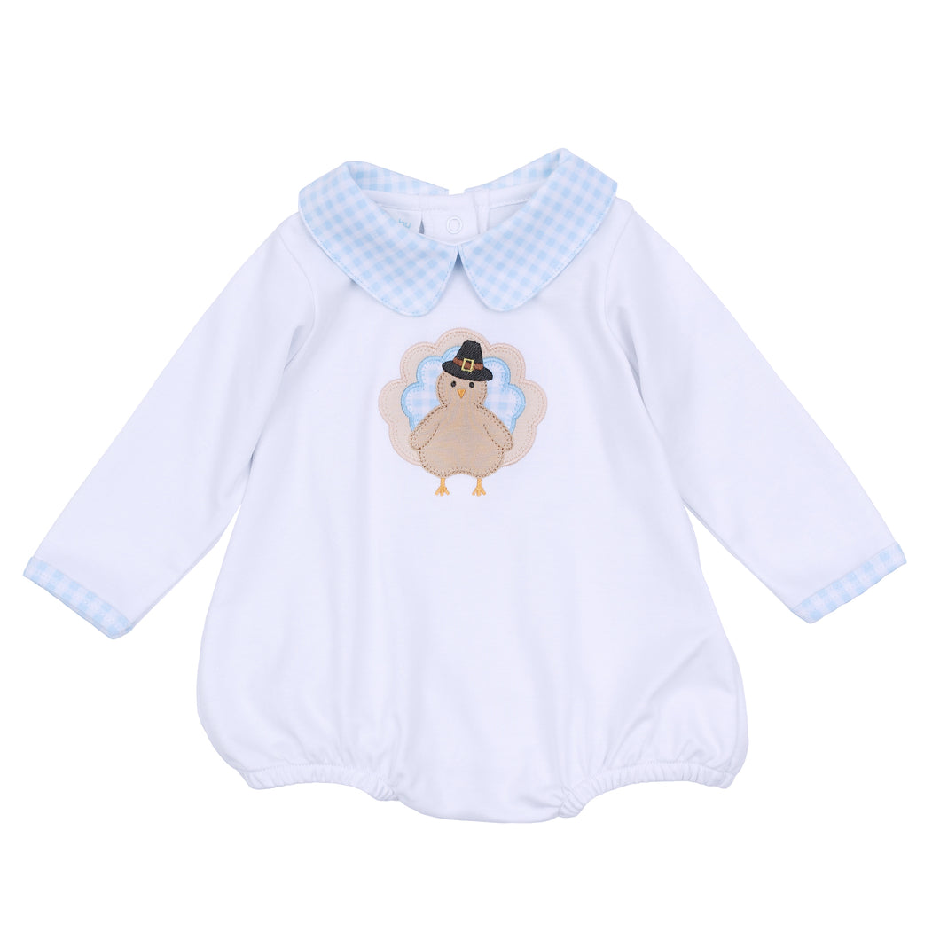 Dress your little one in festive charm with the Pilgrim Pals Applique Collared Bubble by Magnolia Baby. Crafted from soft pima cotton, this bubble ensures gentle comfort for delicate skin. The blue and white check collar adds a classic touch, while the adorable turkey 