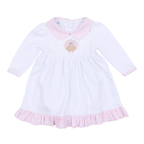 Dress your little one in festive charm with the Pilgrim Pals Applique Collared Dress by Magnolia Baby. Crafted from soft pima cotton, this dress ensures gentle comfort for delicate skin. The pink and white check collar adds a classic touch, while the adorable turkey 