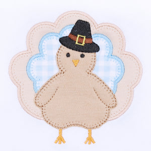 Dress your little one in festive charm with the Pilgrim Pals Applique Collared Bubble by Magnolia Baby. Crafted from soft pima cotton, this bubble ensures gentle comfort for delicate skin. The blue and white check collar adds a classic touch, while the adorable turkey "Pilgrim" applique brings a playful Thanksgiving spirit. Perfect for celebrating the season in style, this bubble combines softness and sweetness for your infant boy's special moments.&nbsp;