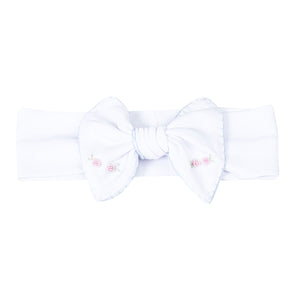 Add a touch of elegance to your little girl's outfit with Charlotte's Classics Embellished Headband. Featuring stunning blue embroidery and delicate rosettes, this headband from Magnolia Baby is perfect for infant girls. Elevate any look and make your little one feel like a princess. Pairs perfectly with other styles within the Charlotte's Classics Collection.