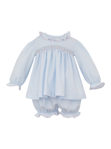 Girls Kaylee Smocked Long Sleeve Bloomer Set from Ananvini combines timeless style with delicate craftsmanship. Its smocked detail and ruffle neckline, adorned with hand-embroidered details, adds a charming, personalized touch. The classic blue hue and long sleeves make it an elegant choice for family photos or special occasions, ensuring your little one looks picture-perfect while staying comfortable.
