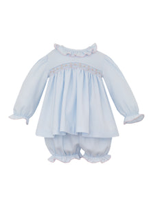 Girls Kaylee Smocked Long Sleeve Bloomer Set from Ananvini combines timeless style with delicate craftsmanship. Its smocked detail and ruffle neckline, adorned with hand-embroidered details, adds a charming, personalized touch. The classic blue hue and long sleeves make it an elegant choice for family photos or special occasions, ensuring your little one looks picture-perfect while staying comfortable.