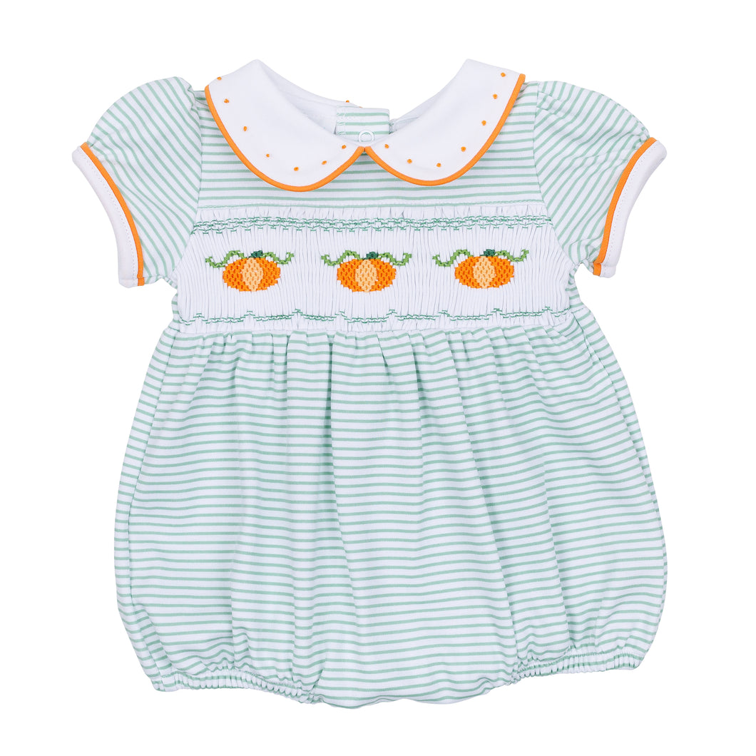 Dress your little one in cozy fall charm with the Lil' Pumpkin Classics Smocked Short Sleeve Girl Bubble in Celery by Magnolia Baby. This adorable infant bubble features delicate smocking, embroidered pumpkin accents, and a timeless collar that blends classic style with comfortable wear. Perfect for autumn days, it’s an easy way to keep your baby looking sweet and seasonally dressed.
