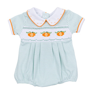 Dress your little one in cozy fall charm with the Lil' Pumpkin Classics Smocked Short Sleeve Boy Bubble in Celery by Magnolia Baby. This adorable infant boy bubble features delicate smocking, embroidered pumpkin accents, and a timeless collar that blends classic style with comfortable wear. Perfect for autumn days, it’s an easy way to keep your baby boy looking sweet and seasonally dressed.
