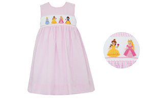 Indulge your beloved toddler with our Princess Smocked Pink Gingham Dress! Featuring a classic pink gingham print with a smocked bodice adorned with beloved princesses, this dress is perfect for special events from now until the end of summer. Light, airy sleeves add the perfect touch of sweetness.