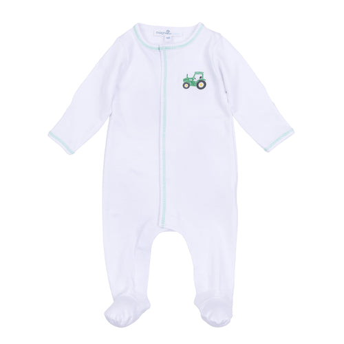 Dress your little one in comfort and charm with the Lil' Green Tractor Embroidered Footie from Magnolia Baby. This soft white footie features convenient snaps for easy changes and delicate green stitching that highlights a playful embroidered tractor on the front. Perfect for everyday wear, it combines practicality with adorable style to keep your baby cozy and looking cute all day long.