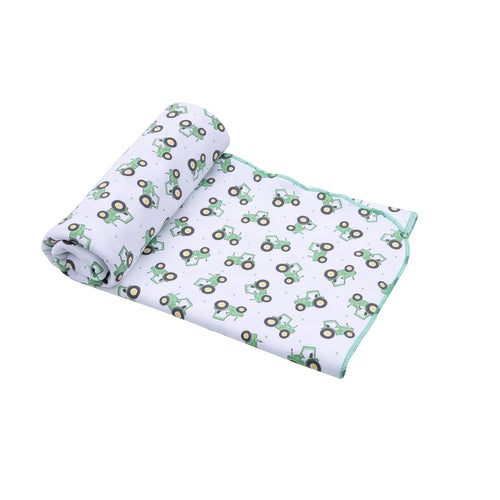 Wrap your little one in cozy comfort with the Lil' Green Tractor Printed Swaddle Blanket from Magnolia Baby. Featuring an adorable tractor print, this soft swaddle provides gentle warmth and security, perfect for soothing your baby. Its breathable fabric ensures all-night comfort, making it an essential for peaceful naps and sweet dreams.