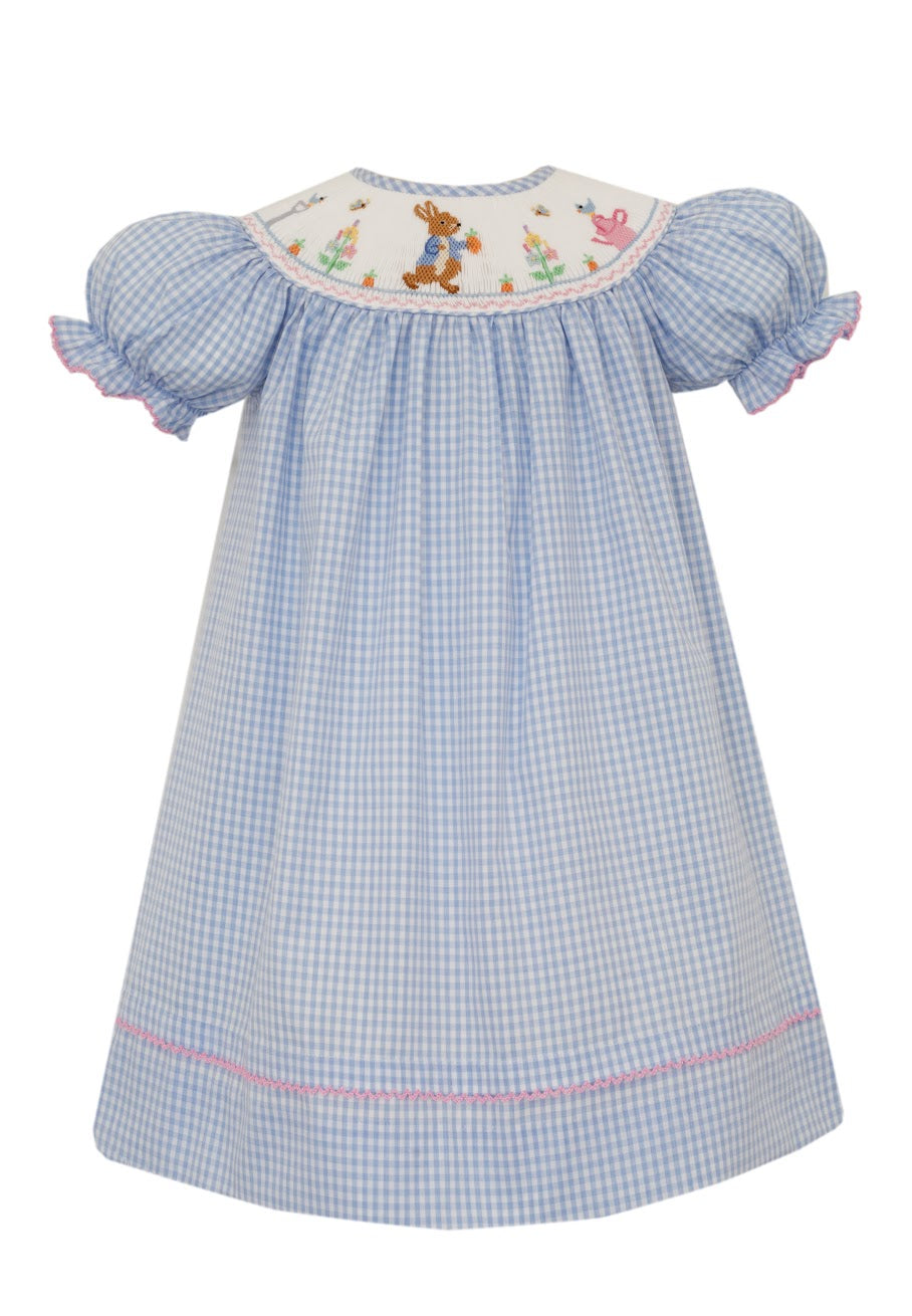 Effortlessly sweet and charming, the Peter Rabbit Bishop Dress by Anavini features a classic blue and white gingham pattern with delicate pink accents and a darling peter rabbit smocking. Perfect for any occasion, this dress will make your little one feel like a storybook character come to life!