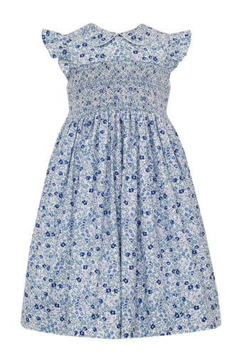 Experience the perfect combination of elegance and style with our Girls Floral Float Smocked Dress from Anavini! This beautiful dress boasts a vibrant blue floral pattern, smocked bodice, flutter sleeves, and peter pan collar. From toddler to young girls, this dress will make your little one stand out in any occasion.