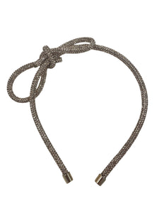 Introducing the Glitter Bow Slim Headband from Anuja Tolia Jewelry! This bedazzled headband features a stunning accent bow and comes in 3 different colors. Perfect for any young fashionista looking to add a touch of sparkle and style to their outfit!