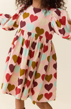 Load image into Gallery viewer, Pink Chicken’s Girls Bea Dress in Multi Harvest Hearts bursts with joyful colors that celebrate every moment. This vibrant dress brings playful charm and comfort to your tween’s wardrobe, making every day feel special and full of heart!
