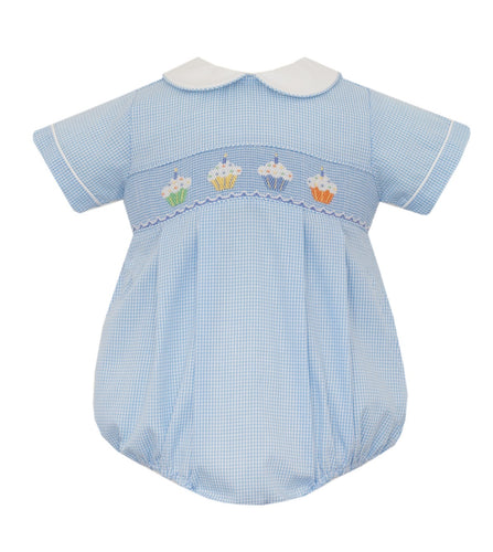 Indulge your little one in the sweetest style with the Infant Boy's Cupcake Bubble by Petit Bebe. This blue gingham bubble is adorned with adorable cupcake stitching and a crisp white collar, making it the perfect birthday outfit for your little gentleman.