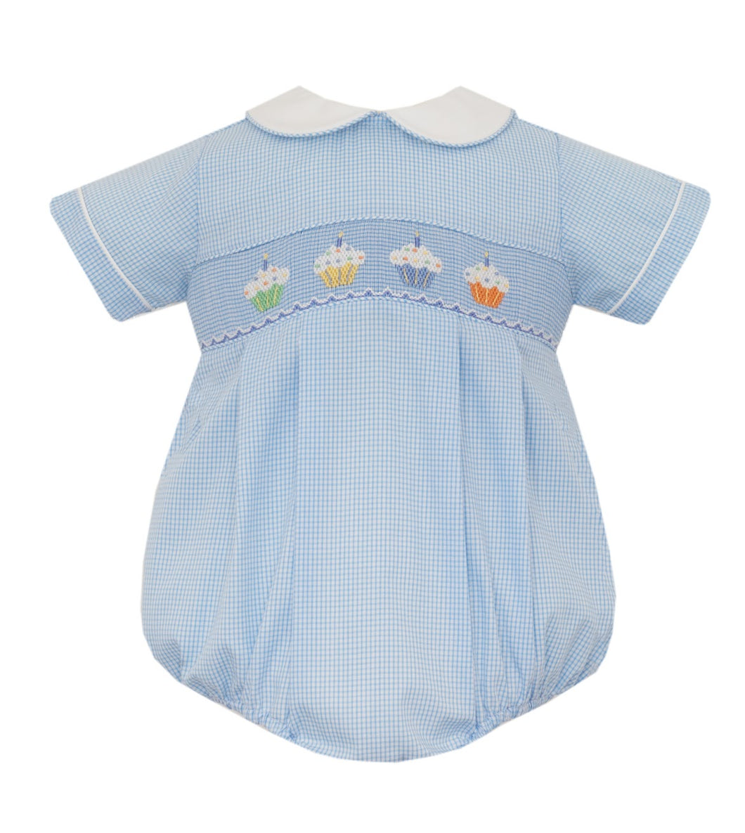 Indulge your little one in the sweetest style with the Infant Boy's Cupcake Bubble by Petit Bebe. This blue gingham bubble is adorned with adorable cupcake stitching and a crisp white collar, making it the perfect birthday outfit for your little gentleman.