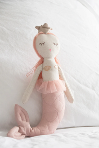 This Mermaid Doll from Great Pretenders is a handcrafted doll, embellished with soft glitter tulle, metallic knits, mo-hair locks, yarn detailing and fanciful expressions / embroidered details. These soft-bodied dolls are perfect for keeping secrets, confiding wishes in, and becoming friends with little ones of all ages. Collectable and Timeless! Approx. 12".