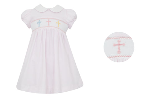 Dress your little one in this Petit Bebe Cross Embroidered Knit Dress. Made with 100% soft cotton, this classic dress is perfect for Easter or any religious occasion. The smocked detail and embroidered crosses add a touch of elegance to the soft pink and white striped design.