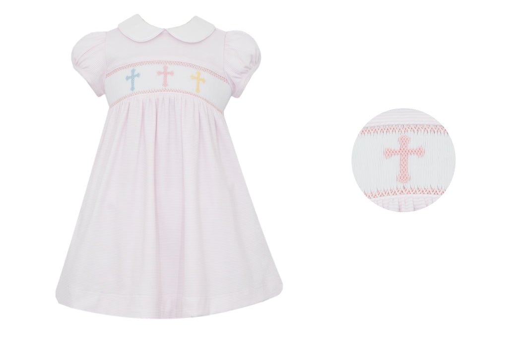 Dress your little one in this Petit Bebe Cross Embroidered Knit Dress. Made with 100% soft cotton, this classic dress is perfect for Easter or any religious occasion. The smocked detail and embroidered crosses add a touch of elegance to the soft pink and white striped design.