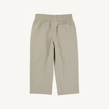 Load image into Gallery viewer, The Prepletic Sheffield Pants in Keeneland Khaki by The Beaufort Bonnet Company blend timeless style with performance fabric, offering comfort and durability for your little one. The classic silhouette and signature stork detail elevate every outfit, perfect for any occasion from playtime to special moments! 
