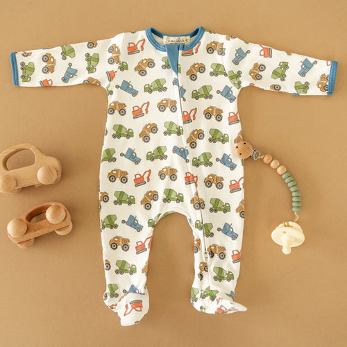 Introducing the Infant Boys Work Zone Footie by Luna + Arlo! This stylish and durable footie features a fun work zone design in vibrant colors, with a pop of cobalt blue on the arms and legs. Comfort and fashion combined for your little one!