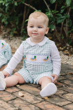 Load image into Gallery viewer, Dress your little one in timeless charm with the Boys Smocked Henry Mallard Jon Jon by Shop Teeta. Featuring a classic green and white gingham check, this Jon Jon is adorned with delicate smocking and detailed embroidered mallard ducks, adding a sweet and playful touch. Perfect for coordinated family moments, it also pairs beautifully with matching sibling styles. This piece combines traditional design with exceptional craftsmanship, making it an irresistible choice for any special occasion or everyday deli
