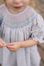 Load image into Gallery viewer, The Smocked Pumpkin Floral Analisa Bishop Dress from Shop Teeta combines charming fall florals with a delicate smocked neckline, creating an adorable look for infant girls. Its playful A-line silhouette allows for comfortable movement while showcasing a timeless design perfect for any autumn occasion. This piece offers both style and softness, making it a must-have for your little one’s wardrobe.

