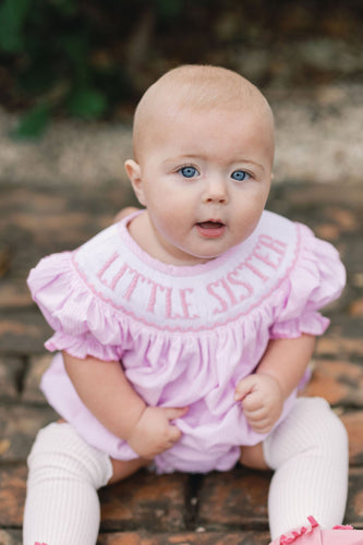 Celebrate her special role with the Infant Girls Little Sister Bishop Bubble from Shop Teeta. Featuring a charming pink and white gingham print and a delicate smocked neckline embroidered with 