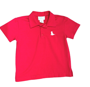Get your son ready for Summer with this Boys Red Polo featuring a cute white puppy logo from James &amp; Lottie. Made for boys of all ages, it pairs perfectly with any shorts for a stylish and adorable outfit. Perfect for any Summer celebration or casual day out!