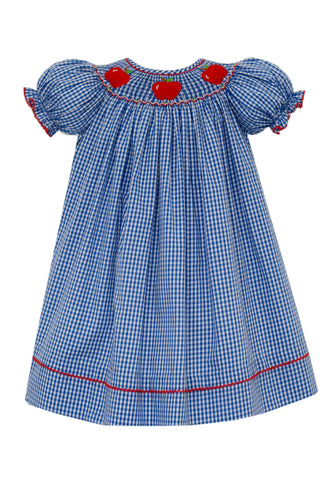 The Girl's Apple Bishop Gingham Dress from Anavini combines classic charm with playful details. Featuring a delicate smocked neckline adorned with red apple embroidery, this blue and white check dress is accented by a vibrant red hem. Its timeless design and comfortable fit make it an ideal choice for back-to-school days, ensuring your little one looks both stylish and ready for the classroom.