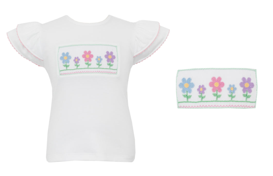 The Girl's Flower Smocked Angel Tee from Anavini is a charming white knit top designed with delicate angel flutter sleeves and a beautifully smocked bodice adorned with embroidered flowers. This sweet and stylish tee pairs perfectly with the Anavini Green Gingham Shorts, creating an adorable outfit that’s both comfortable and eye-catching for your little girl. Ideal for warm days and special occasions, it adds a touch of elegance and playful charm to her wardrobe.