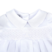 Load image into Gallery viewer, Give your little one a stylish and meaningful look with our Infant Blessed Bubble from Magnolia baby. This adorable bubble features a classic peter pan collar, white smocking, and a cross detail to symbolize blessings. Dress them in comfort and style for any Baptism or religious occasion.
